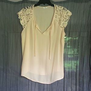 Beautiful chiffon like blouse, with lace cap sleeves. NWOT
